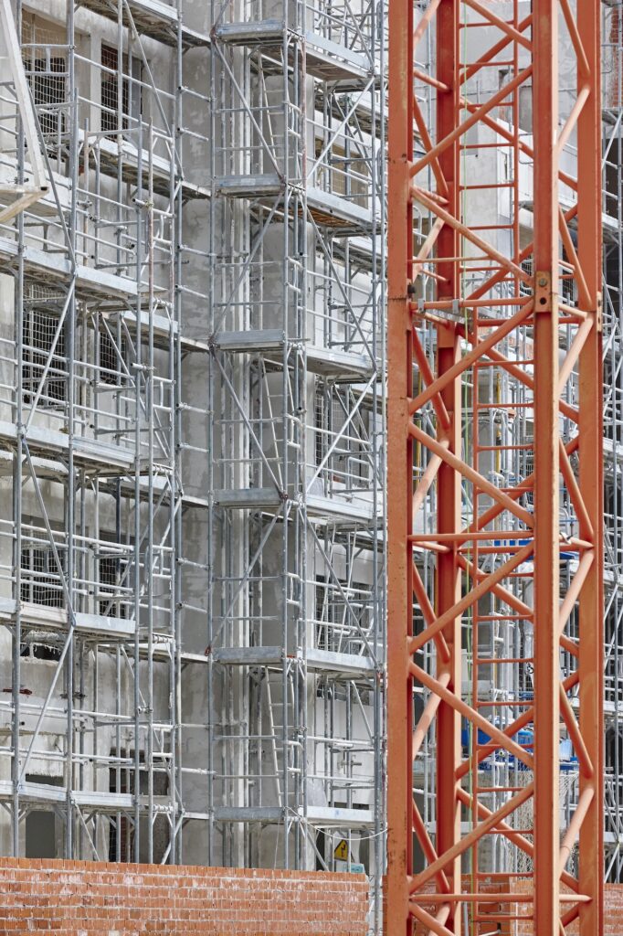Building facade under construction. Concrete structure. Architecture. Vertical
