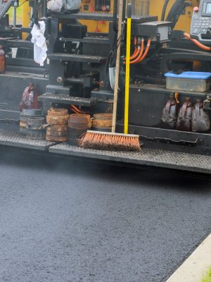 asphalt paving Tampa, a machine during road industrial pavement truck laying fresh asphalt on